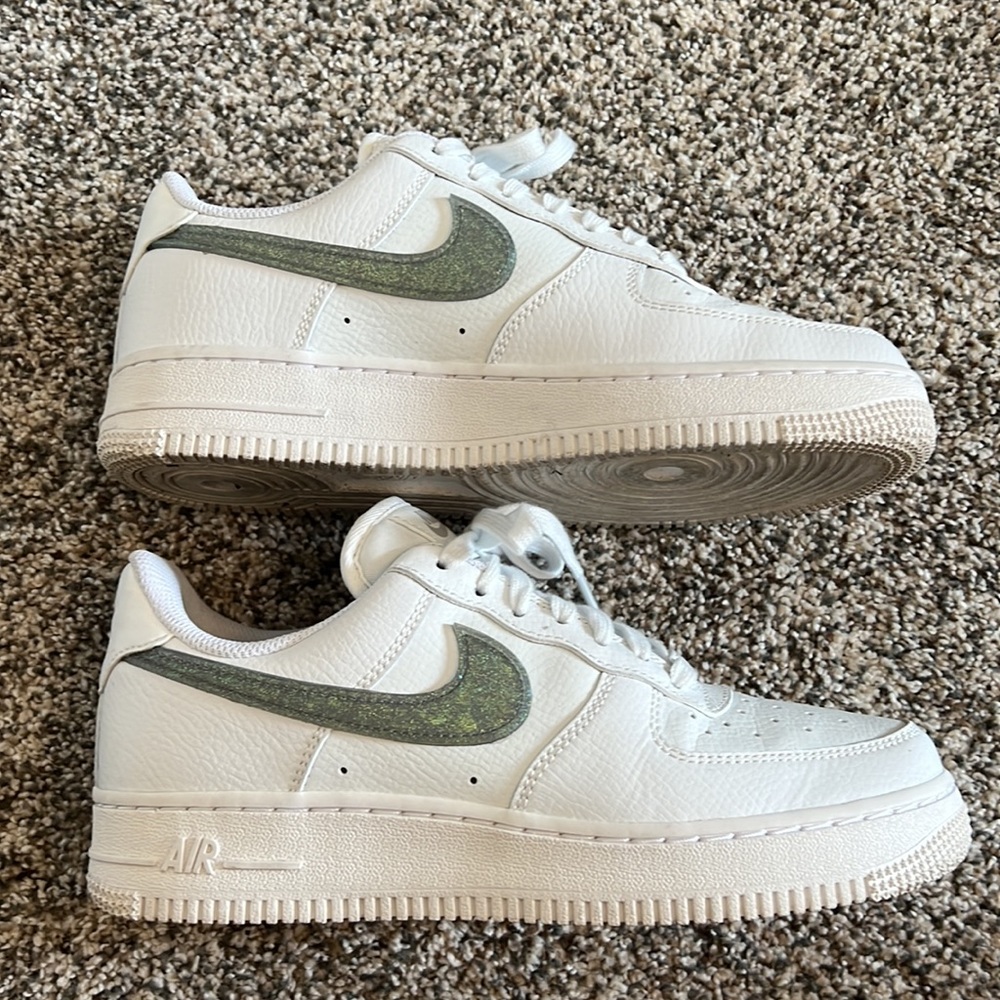 Like new nike women’s Air Force once with green sparkle swoosh. Size 7